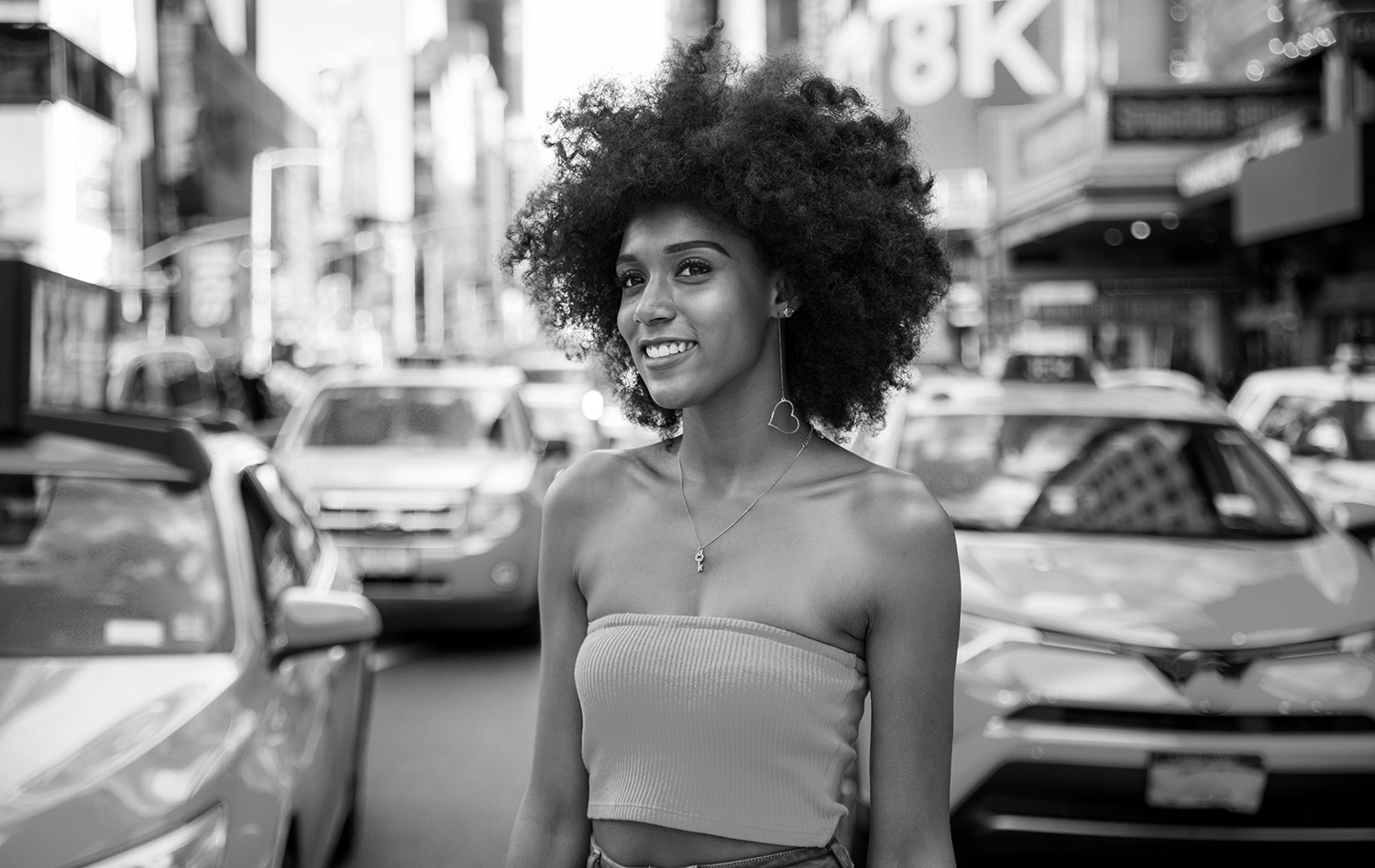 Young beautiful girl walking in Time square, manhattan. Lifestyl